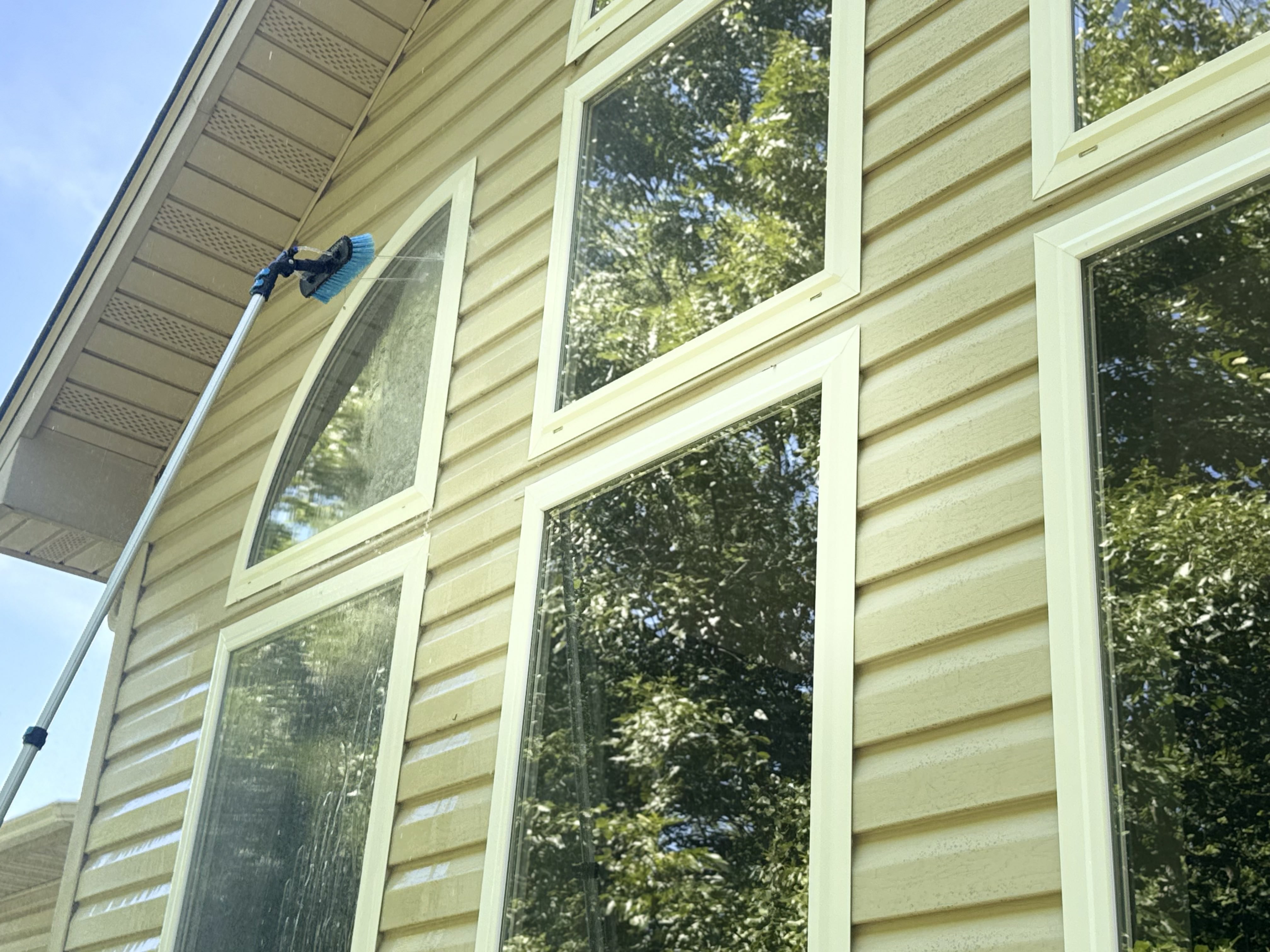 Water fed pole cleaning second story windows